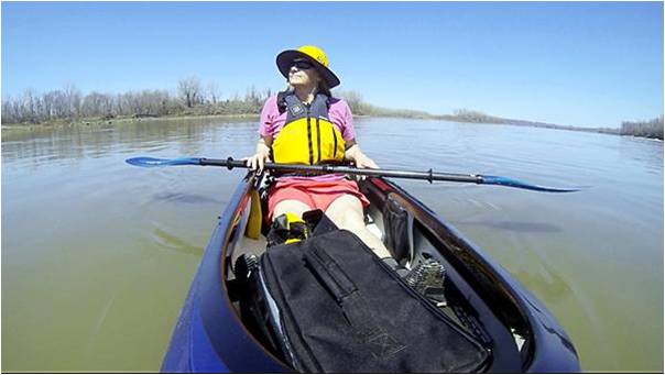 Janet Moreland floats down the Missouri River on Sunday. Moreland leaves for her 2,600 mile kayak trip on April 14 from the source of the river in Montana to St. Louis. The trip will take her three and a half months.