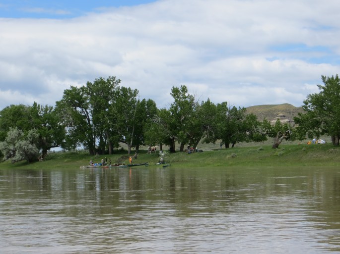 The Boy Scouts made camp early in a beautiful area that was wide open with smaller cliffs surrounding the area.